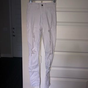 Distressed skinny high-waisted white jeans